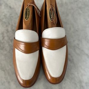 Beautifully crafted spectators. size 7 rich caramel tone against white.